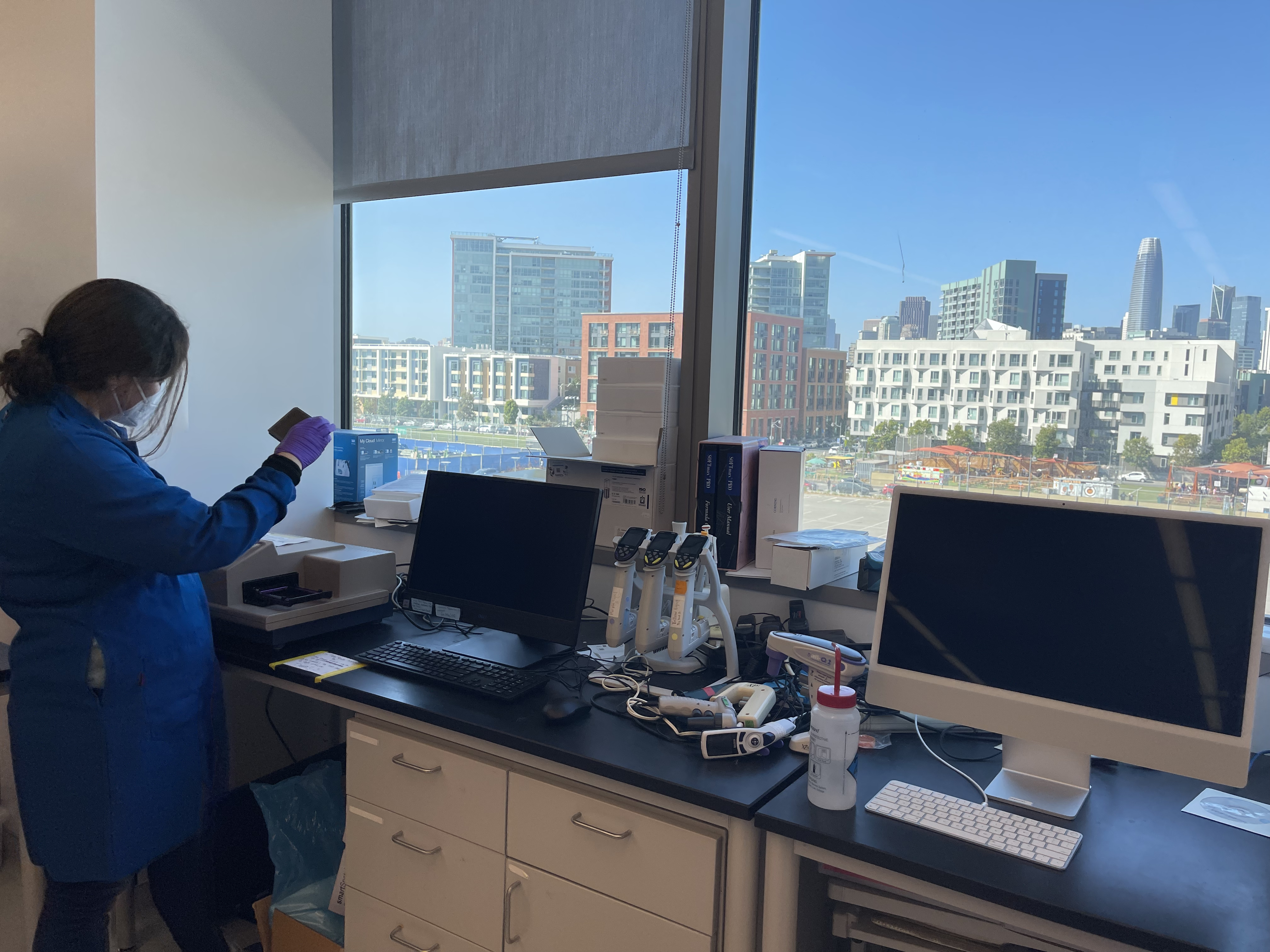 IND member working in front of lab view of San Francisco