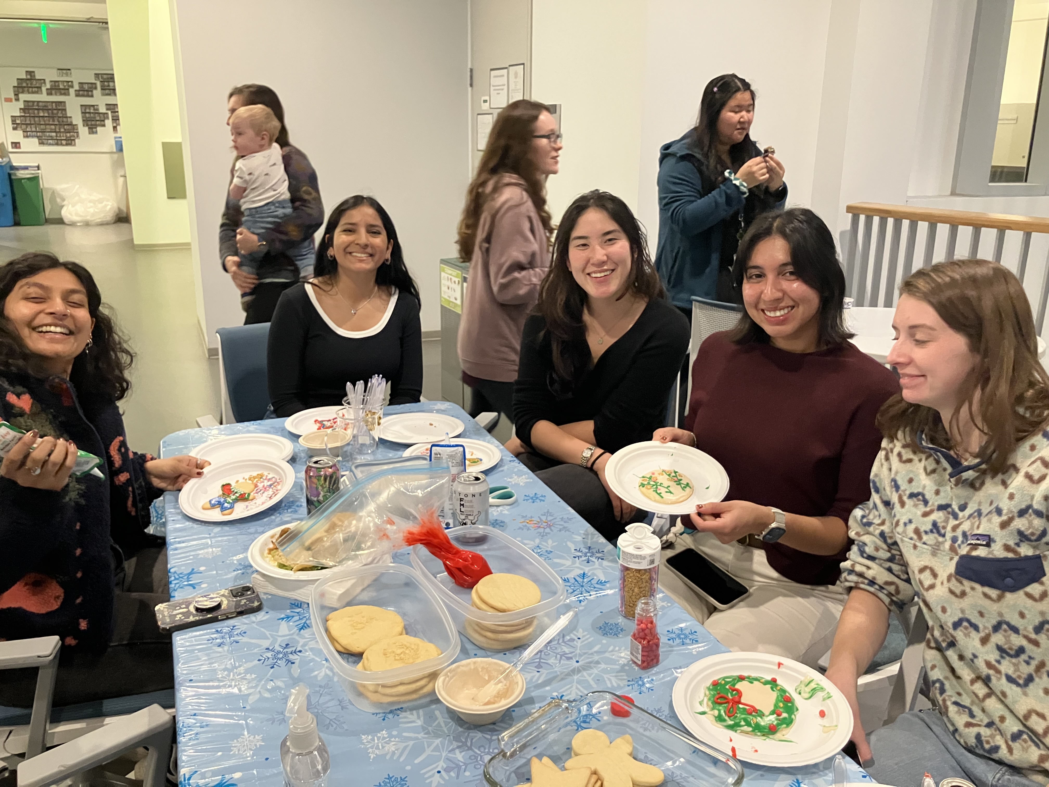 IND members decorating holiday cookies